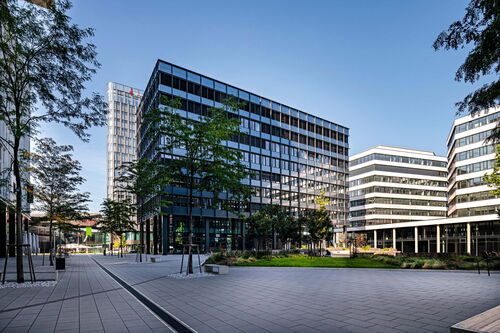 Modern office buildings in an urban setting under bright sunshine